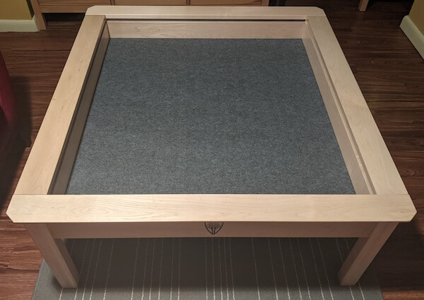 Adding the felt base to the inside of the table